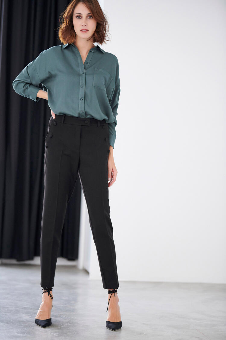 Trousers with decorative buttons in the pocket - Black S