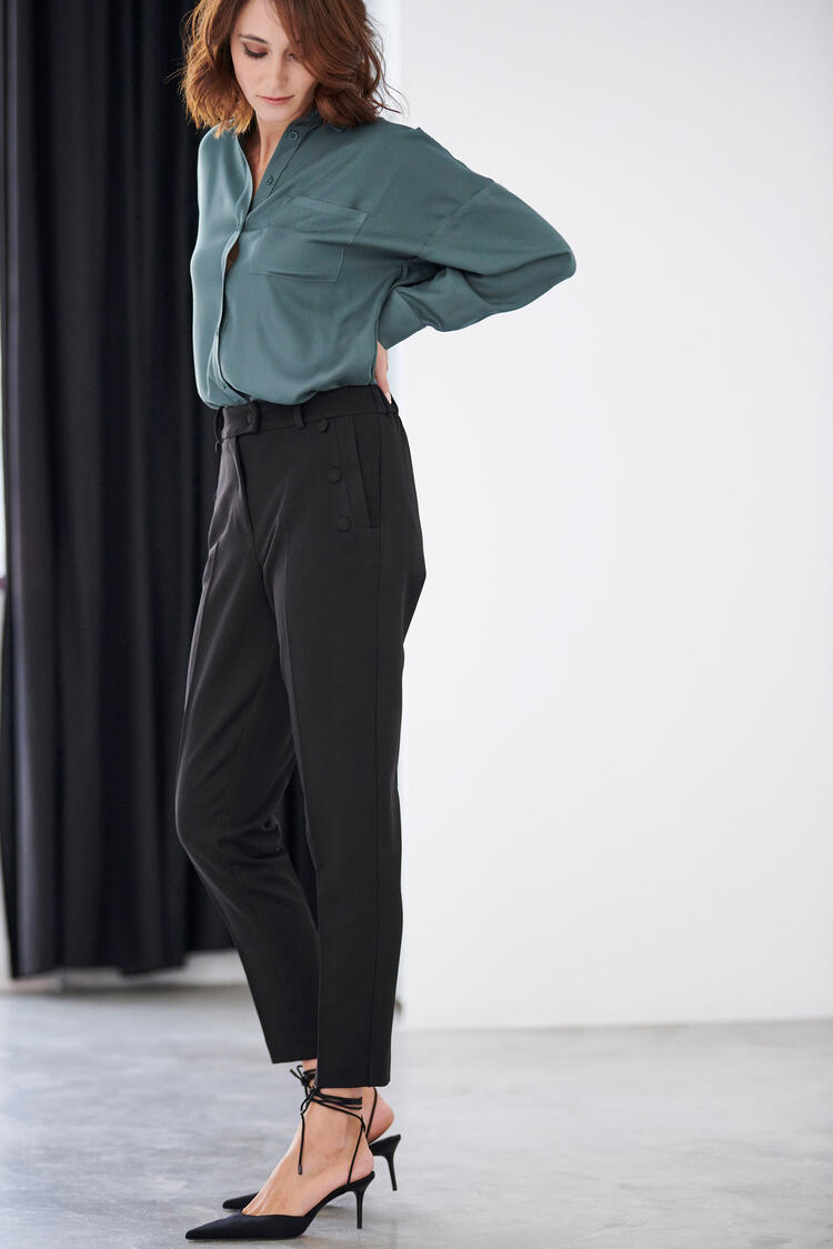 Trousers with decorative buttons in the pocket - Black S