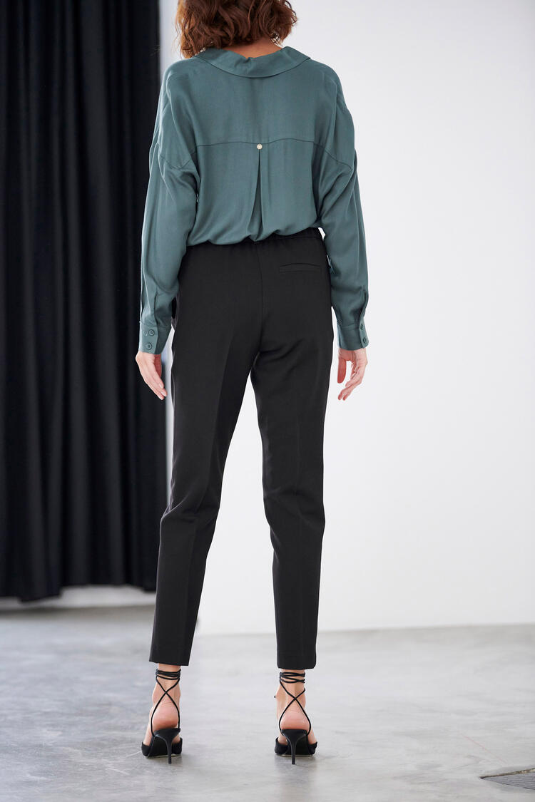 Trousers with decorative buttons in the pocket - Black S